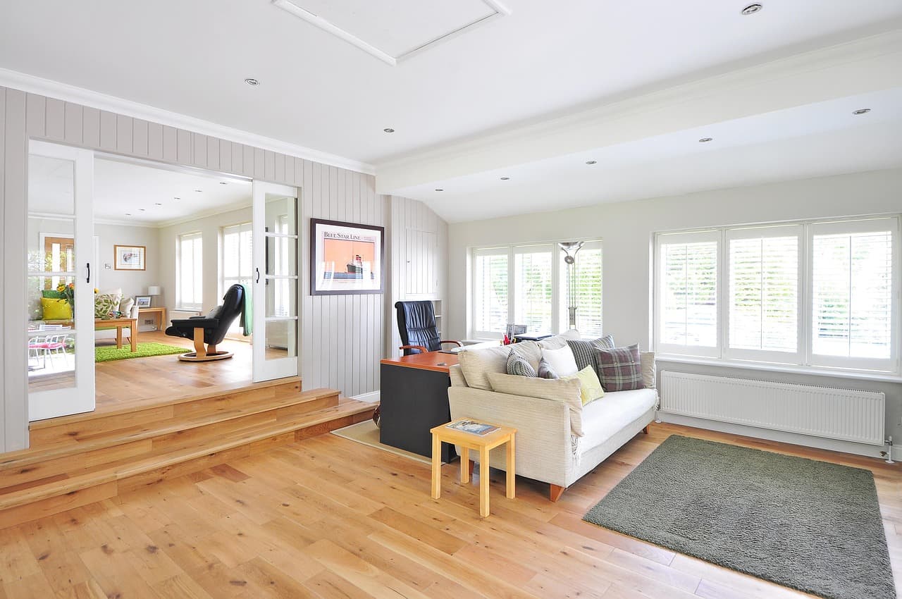 A bright living room with radiators under the windows